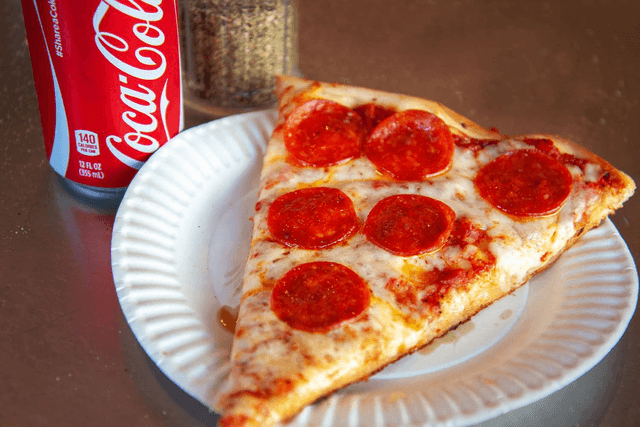 Have a $1 pizza slice Image of Have a $1 pizza slice